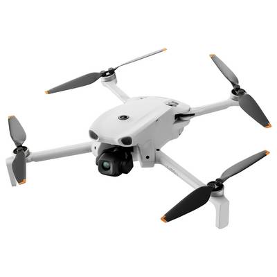 Drone blanc à quatre hélices avec caméra montée sur un fond neutre