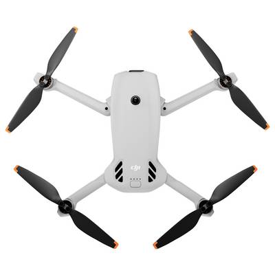 Drone quadcoptère DJI blanc avec quatre hélices noires vu de dessus sur un fond blanc uni.