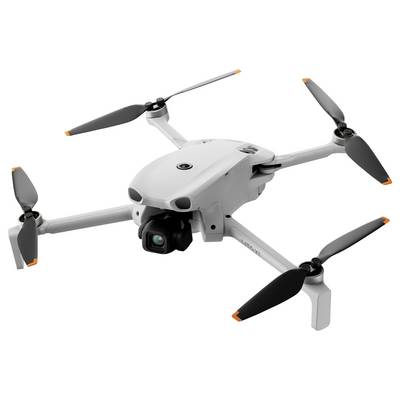 Drone quadcoptère blanc avec quatre hélices et une caméra montée à l'avant, présenté isolé sur un fond neutre.