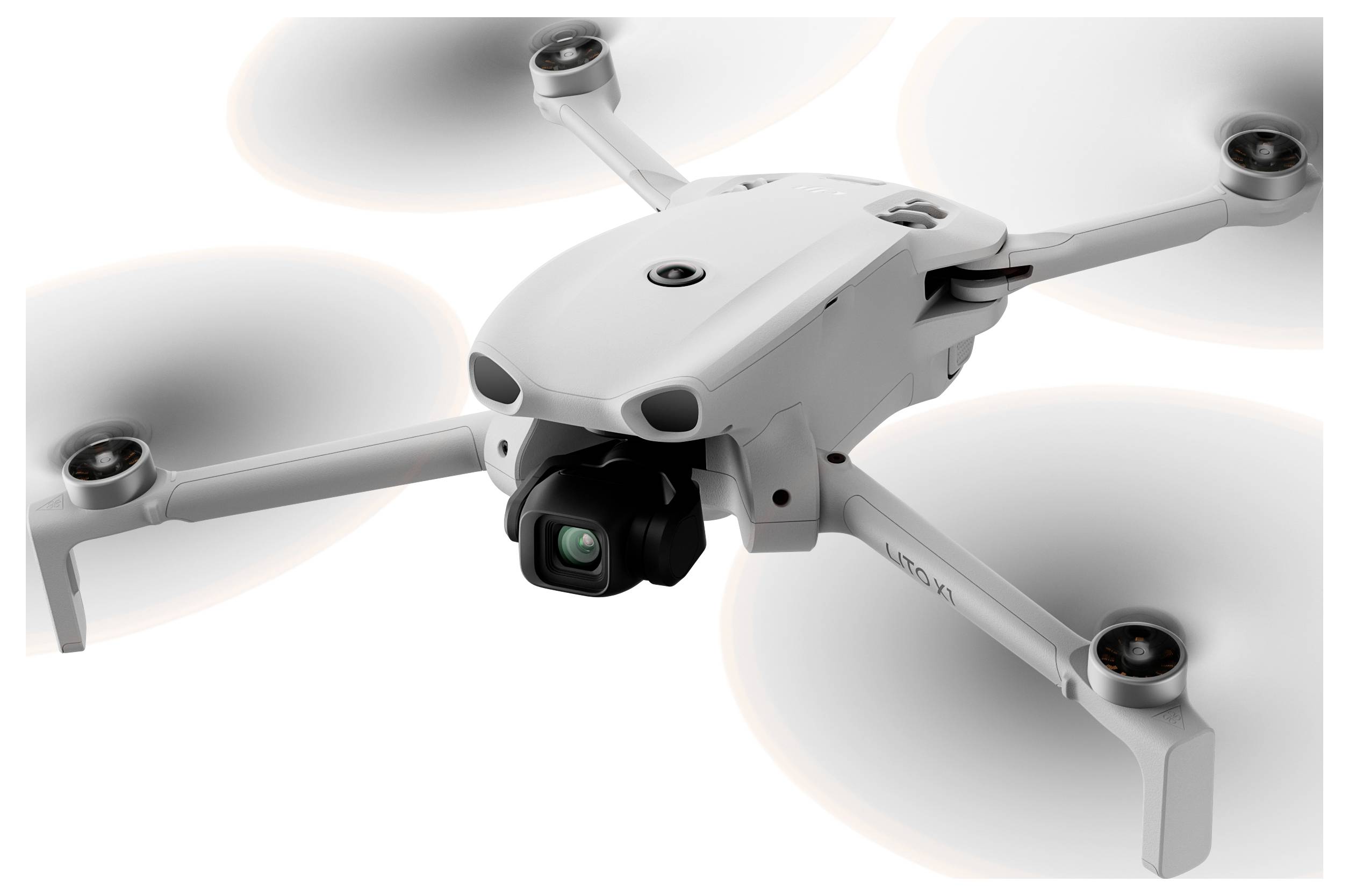 Un drone quadcoptère blanc avec un cardan de caméra et quatre hélices rotatives, présenté sur un fond clair uni.