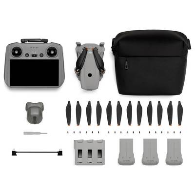 Kit de contrôleur de drone présenté avec l'avant et l'arrière du contrôleur, un étui de transport, plusieurs hélices de rechange, un tournevis, un concentrateur de charge, un câble de charge et trois batteries.