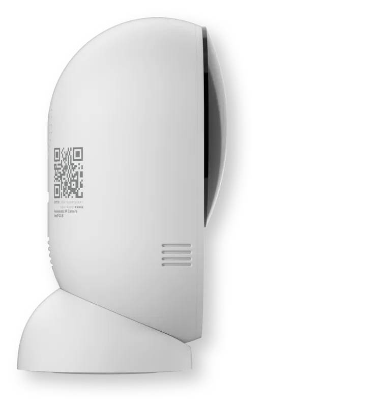 Appareil blanc monté au mur avec un couvercle incurvé, une étiquette de code QR, une grille de ventilation latérale et un socle de base, présenté en profil sur un fond neutre.