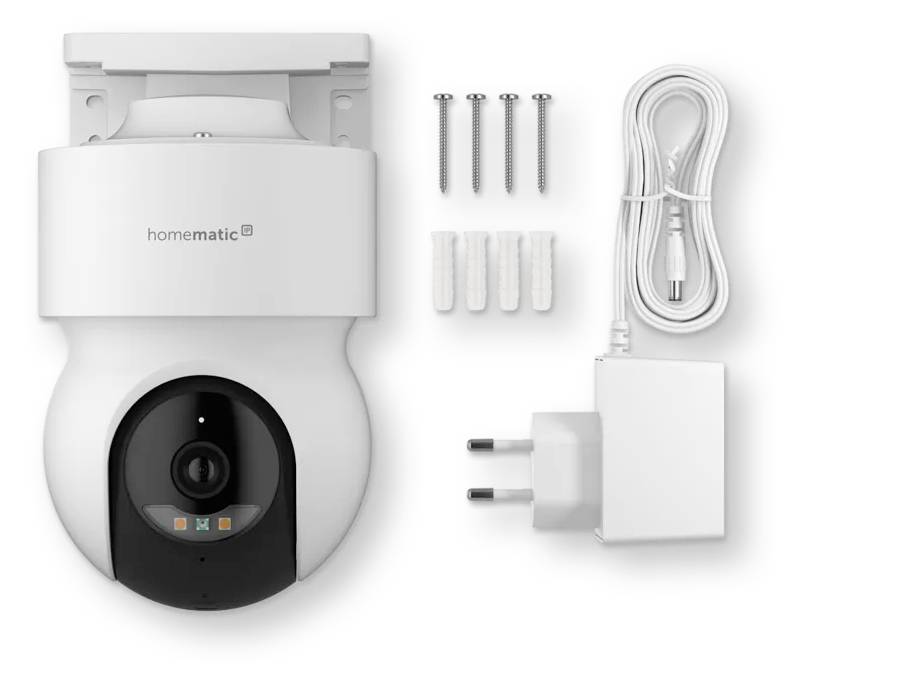 Appareil photographique intelligent mural Homematic avec vis incluses, chevilles murales, adaptateur secteur et câble de charge disposés sur un fond blanc.