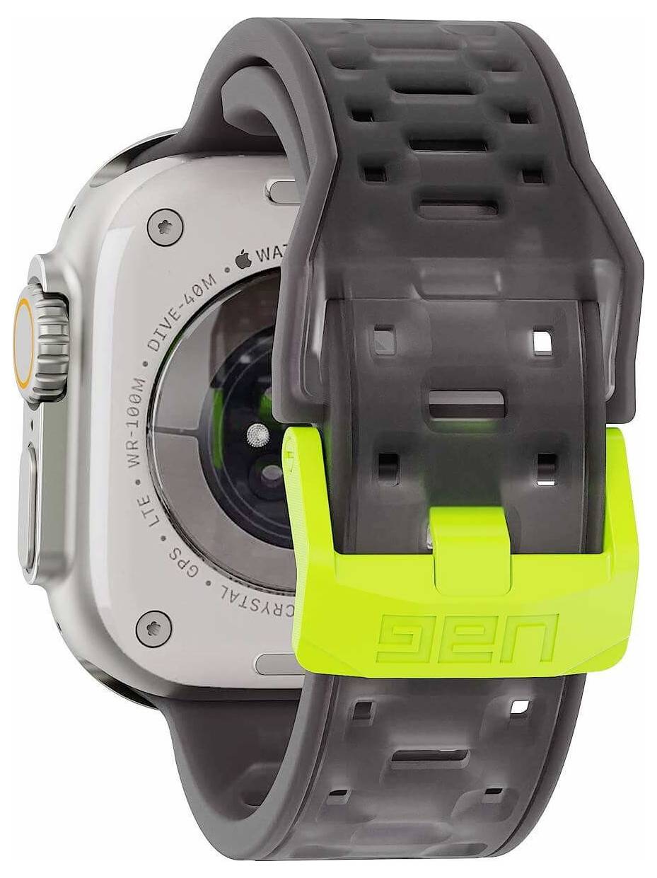 Montre Apple Watch avec un bracelet de protection robuste et un boîtier gris foncé et jaune néon, présentés en vue rapprochée de profil.