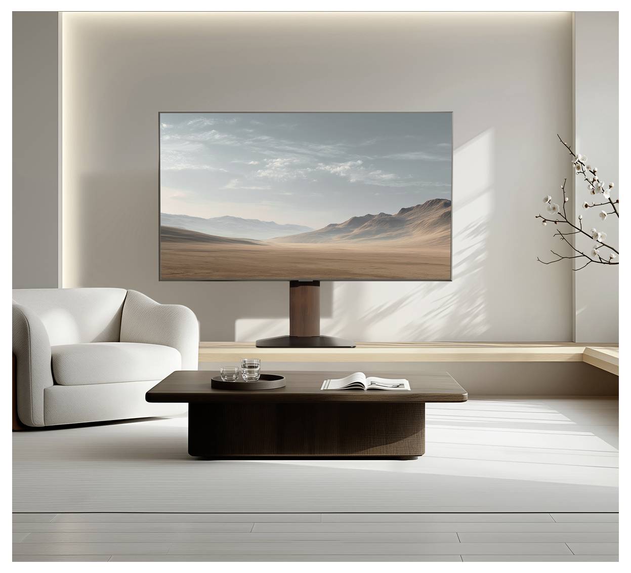 Salon moderne avec un fauteuil blanc, une table basse en bois et une télévision murale affichant un paysage désertique.