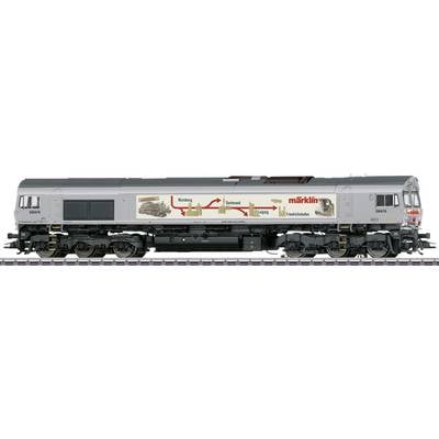 Vue latérale d'une maquette de locomotive de marchandises grise Märklin sur rail, avec marquage rouge et diagramme de flèches sur le côté.