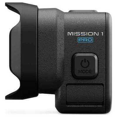 Accessoire compact noir pour appareil photo étiqueté « MISSION 1 PRO » avec un bouton d'alimentation « MODE » et un système de fixation latérale.