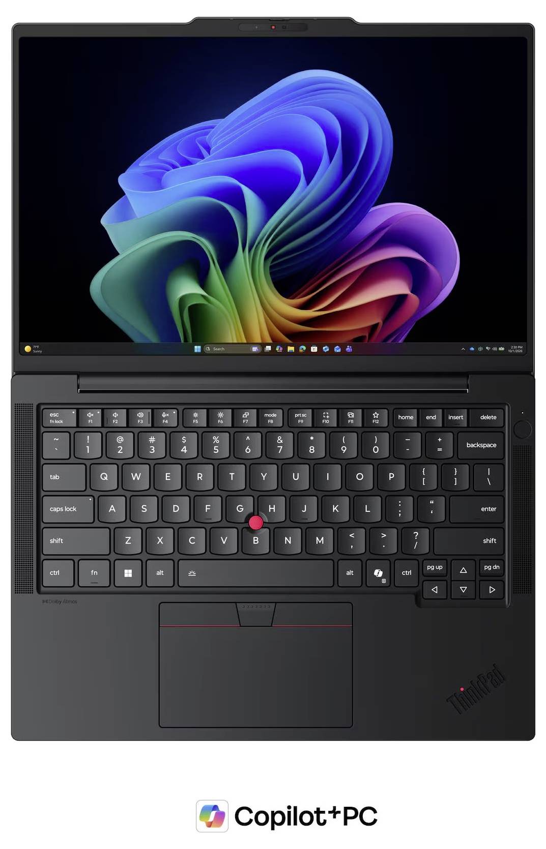Ordinateur portable Lenovo ThinkPad noir ouvert avec le fond d'écran Windows 11 sur l'écran et le logo Copilot+ PC affiché en dessous, montré de face avec le clavier et le pavé tactile visibles