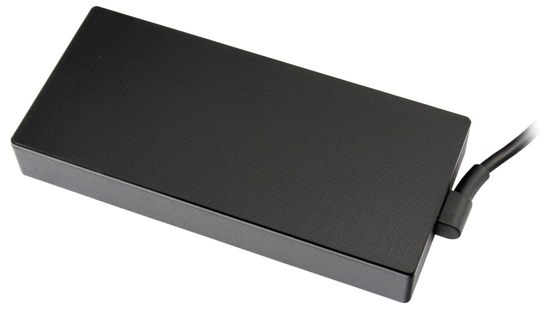 Appareil électronique rectangulaire noir avec un câble connecté, présenté sur un fond blanc.