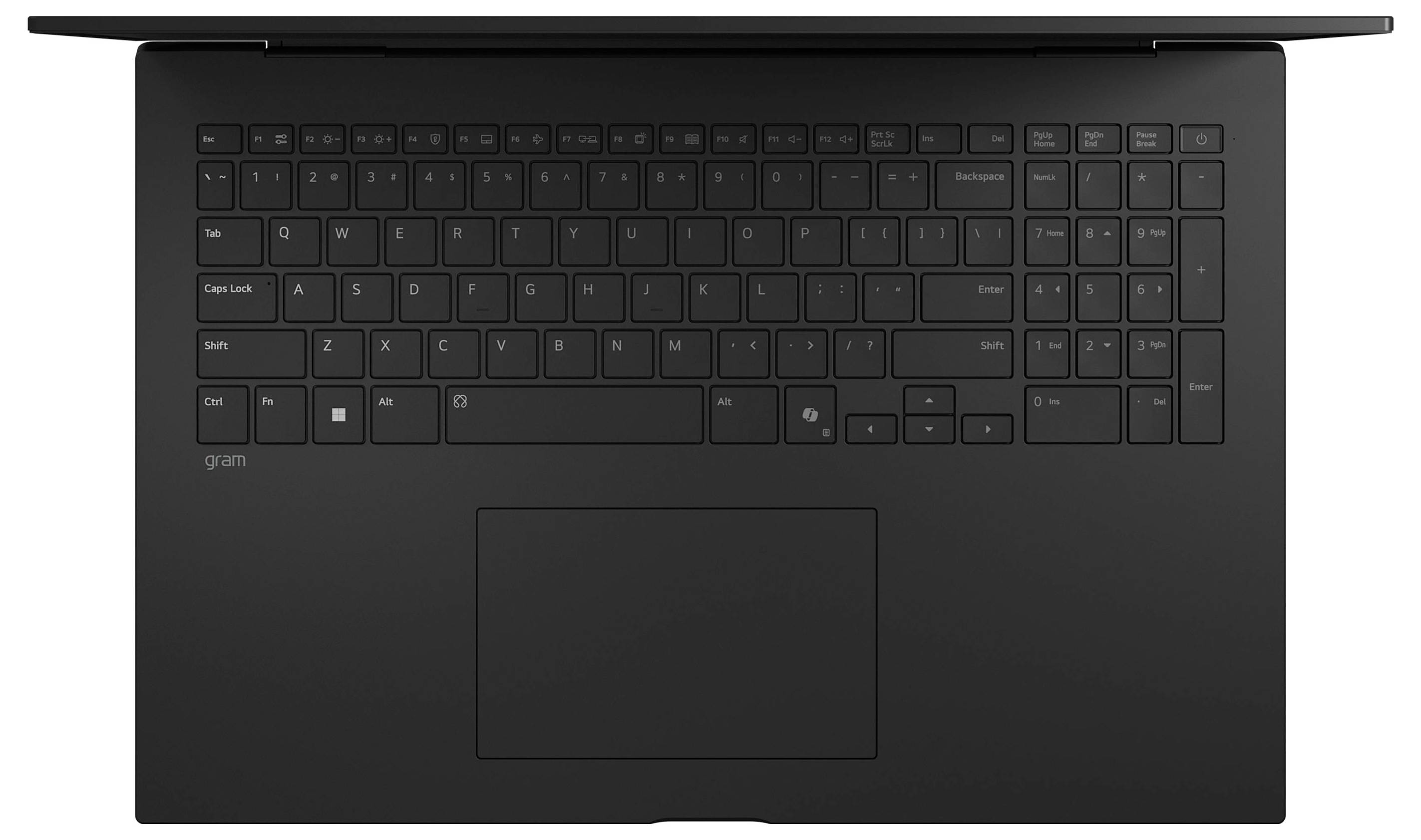 Vue de dessus d'un ordinateur portable noir montrant le clavier et le grand pavé tactile centralisé.