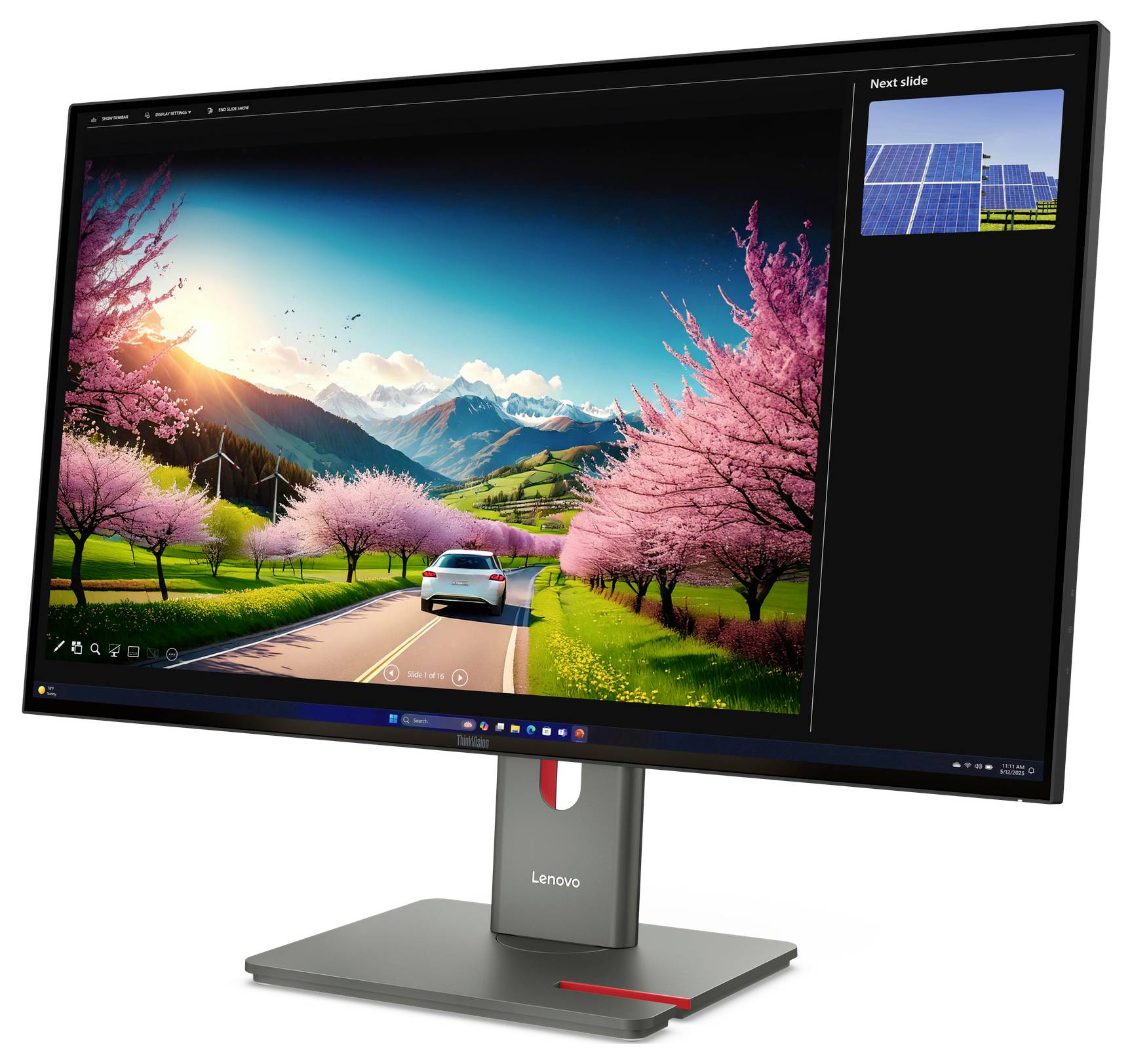 Moniteur Lenovo affichant une scène routière vivante avec une voiture, des arbres en fleurs roses, des montagnes et une miniature « Diapositive suivante » à droite.