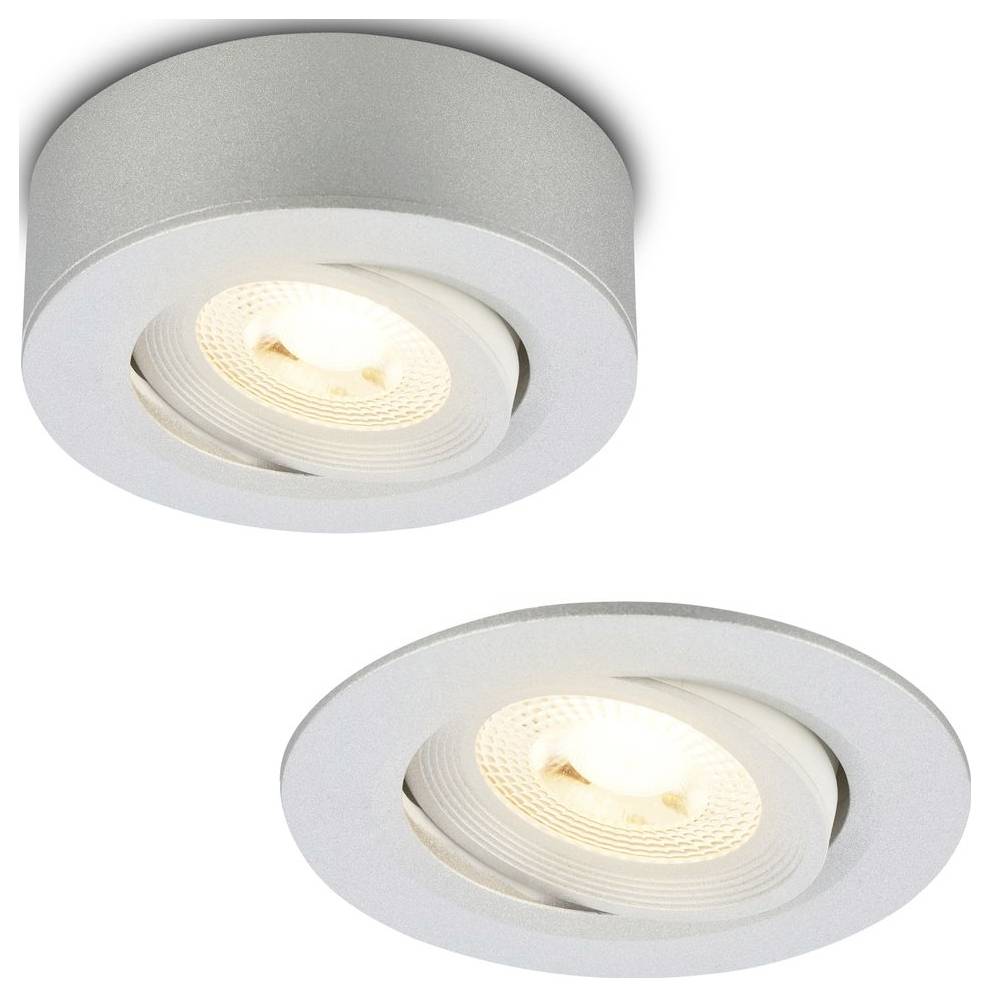 Deux luminaires de plafond encastrés LED ronds, l'un montré allumé en angle.
