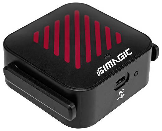 Module industriel SIMATIC noir compact avec des rayures ressemblant à des évents rouges et un port USB-C, montré en perspective sur un fond blanc.