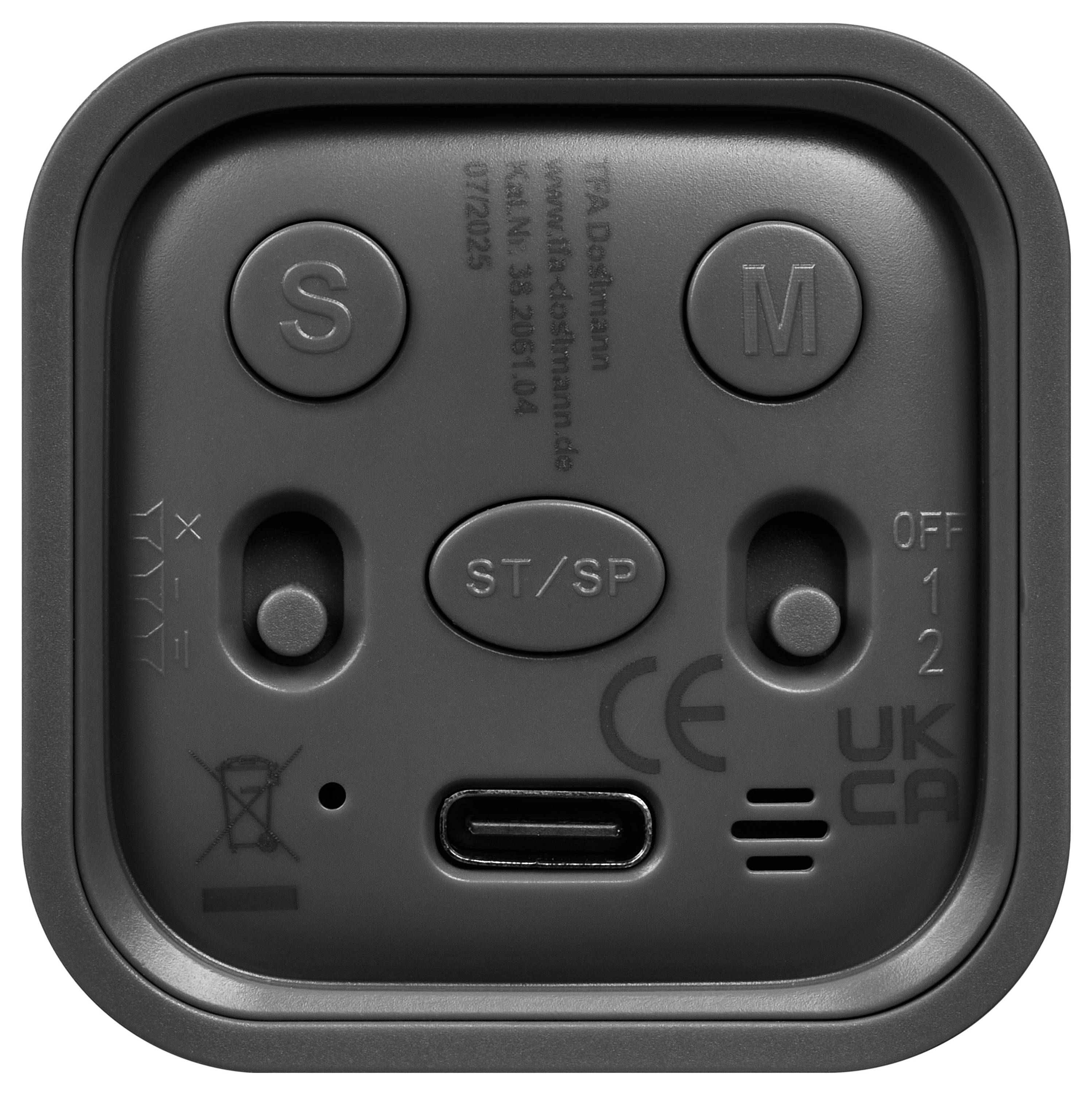 Vue de face d'un appareil électronique noir de forme carrée avec des boutons S, M et ST/SP, deux curseurs, un port USB-C et des marquages CE/UKCA.