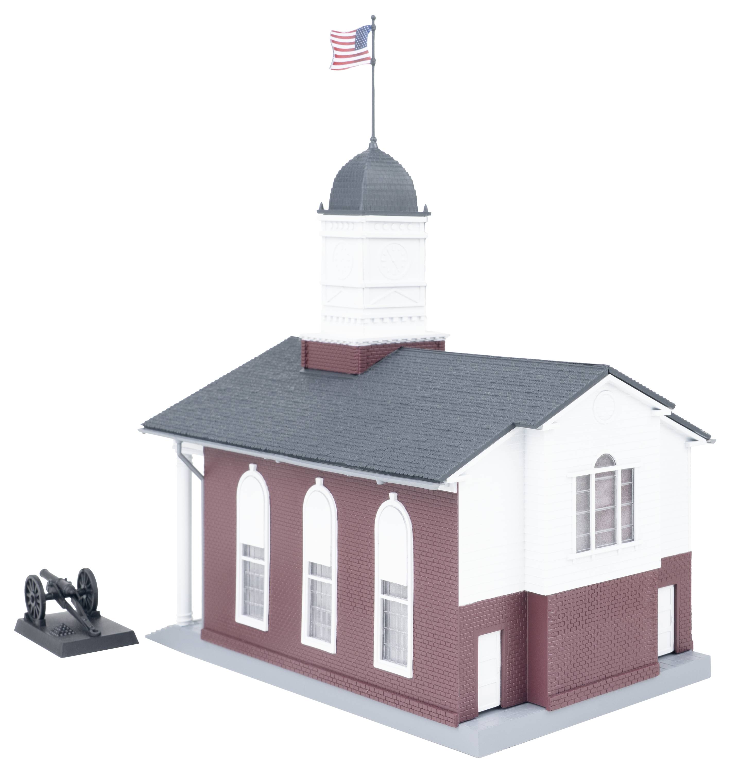 Rendu 3D d'un petit bâtiment d'église rouge et blanc avec un clocher et un drapeau américain, montré à côté d'un modèle de canon séparé sur un fond blanc.