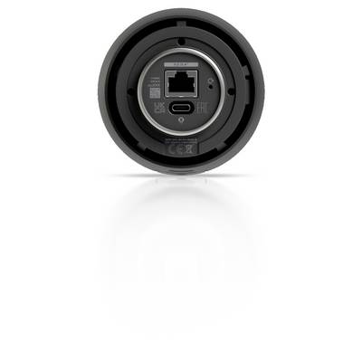 Vue arrière d'un appareil noir rond montrant un port Ethernet central et un port USB-C, avec des marquages de certification autour du panneau de connecteurs.