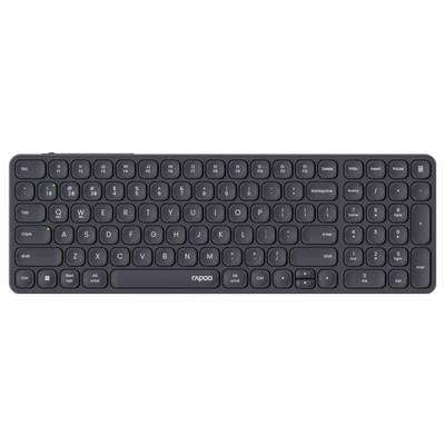 Clavier sans fil noir compact avec des touches arrondies, pavé numérique et logo « rapoo » centré sous la barre d'espace.