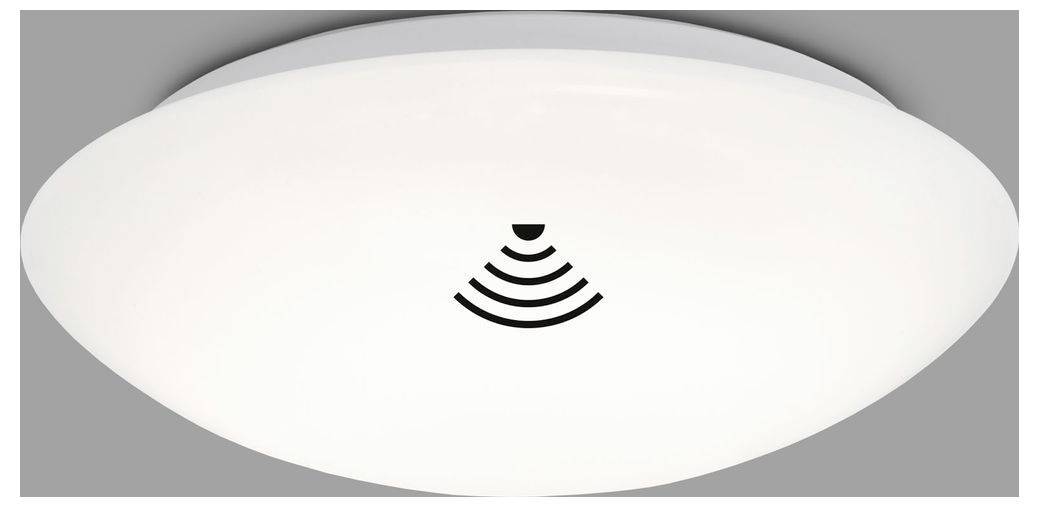 Appareil d'éclairage de forme ovale blanche avec une petite icône de signal sans fil noire centrée dessus, présenté sur un fond gris.