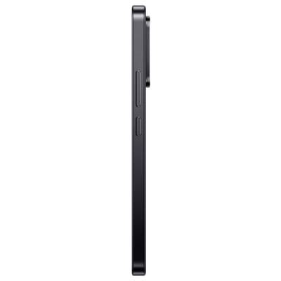 Vue latérale d'un smartphone noir montrant les boutons latéraux et le profil mince.