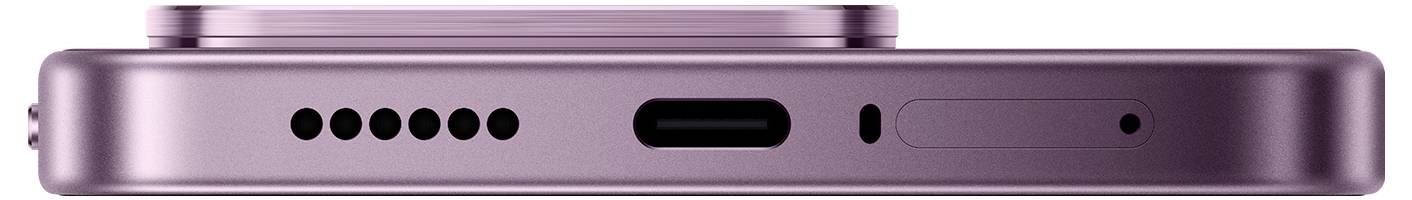 Gros plan du bord inférieur d'un smartphone rose montrant une rangée de trous de haut-parleur, un port de charge USB-C, une ouverture de microphone et une fente de plateau SIM.