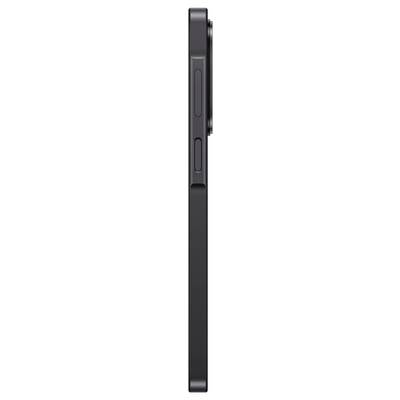 Vue latérale d'un smartphone noir montrant les boutons de volume et le commutateur latéral sur son bord.