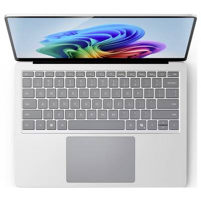 Un ordinateur portable vu d'en haut avec un écran ouvert, un clavier gris et un grand pavé tactile ; l'écran affiche un fond d'écran Windows abstrait et coloré.