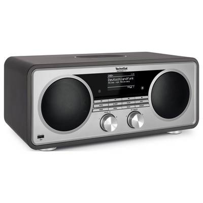 Poste de radio de table TechniSat argenté et noir avec deux grands haut-parleurs et un écran central affichant « Deutschlandfunk » et « Alles von Relevanz ».
