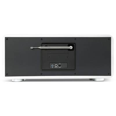 Vue arrière d'un appareil audio noir montrant un panneau de connexion central avec des ports et un bras de commande en métal, monté dans une zone encastrée rectangulaire.