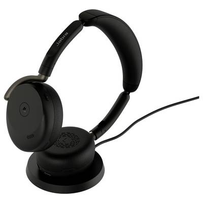 Casque Jabra supra-auriculaire noir reposant sur un support de recharge avec câble attaché.