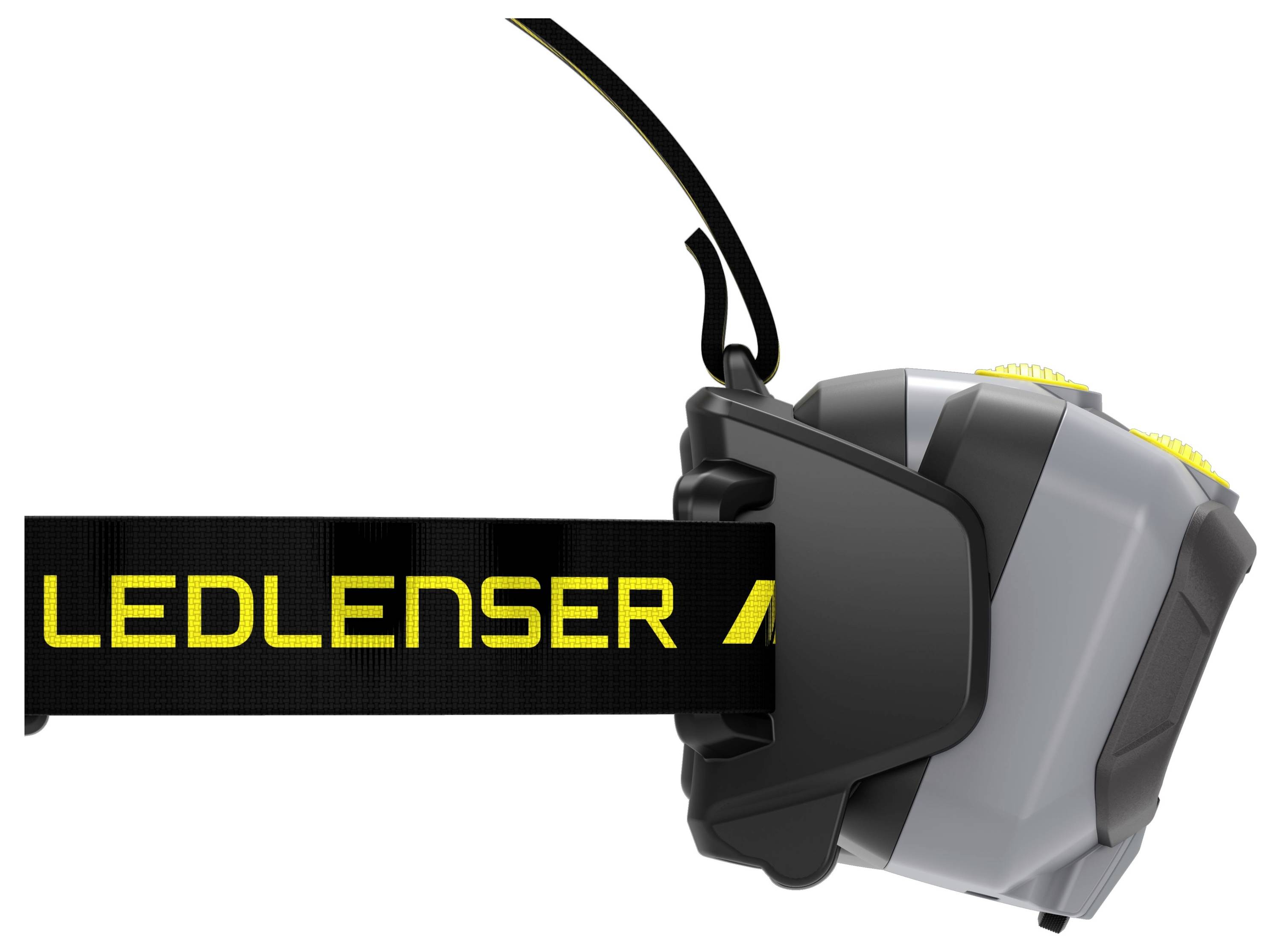Gros plan d'une lampe frontale LED noir et gris avec une bande élastique étiquetée « LEDLENSER » sur un fond blanc.