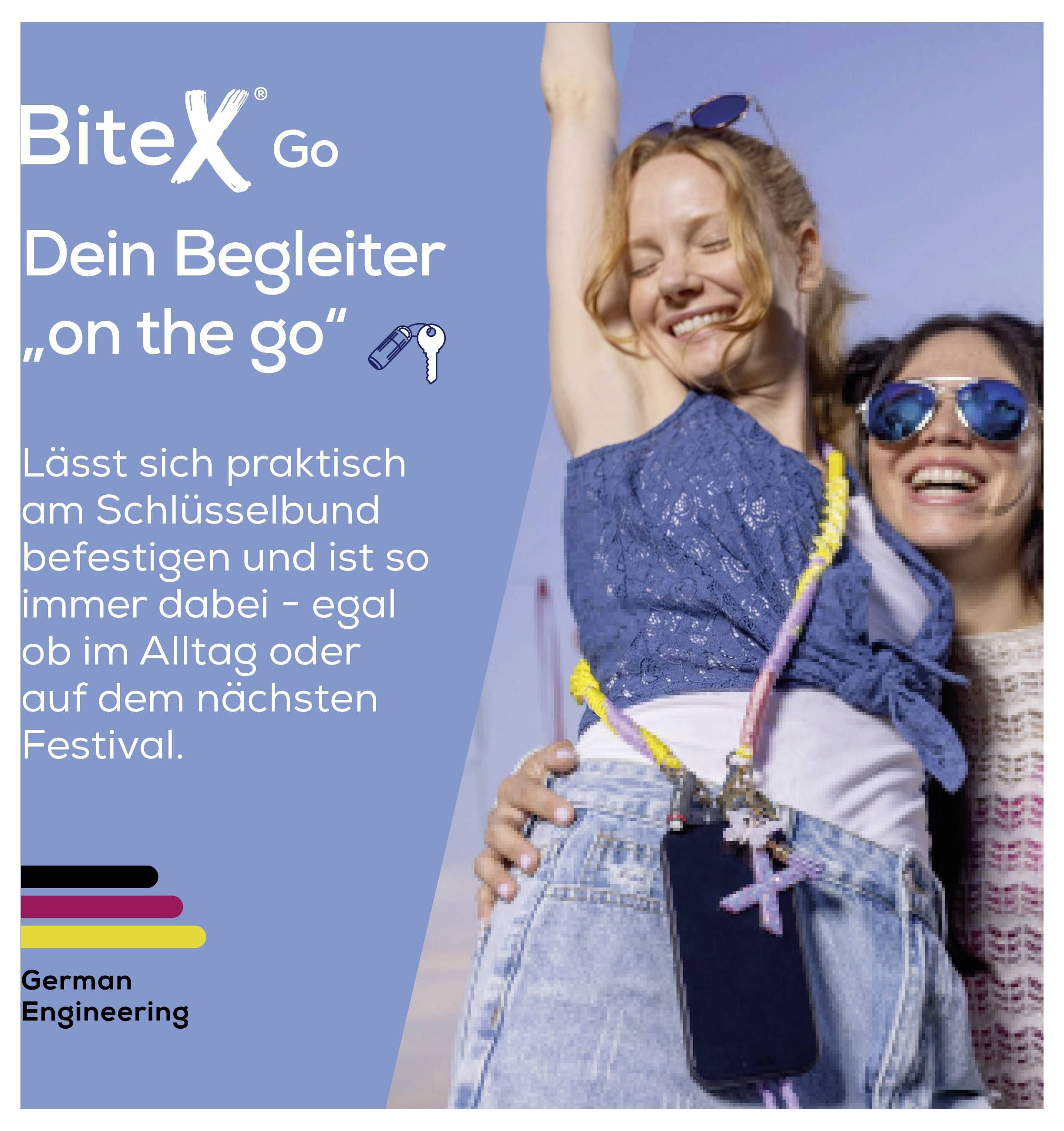 Affiche publicitaire pour BiteX Go : deux femmes souriantes au festival, l'une avec un porte-clés ; texte : « Ton compagnon en déplacement », pratique à attacher à ton trousseau de clés.