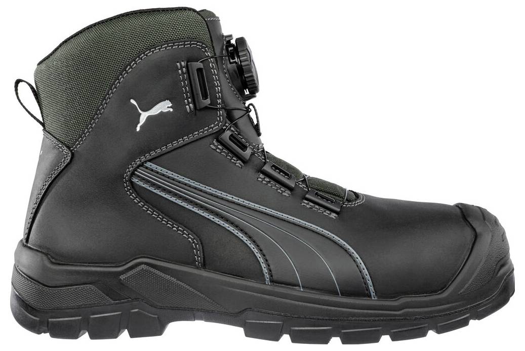 Botte de travail montante Puma noire et verte avec fermeture éclair latérale, fermeture à lacets et semelle crantée robuste sur fond blanc