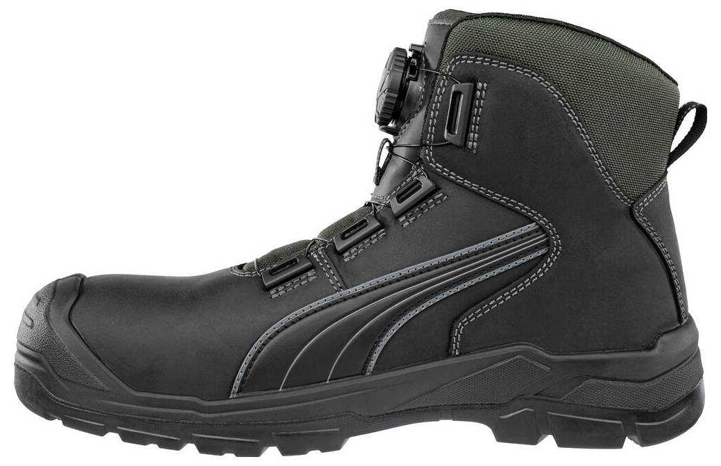 Botte de travail montante noire avec semelle robuste, lacets latéraux et col rembourré vert présentée de profil sur fond blanc.