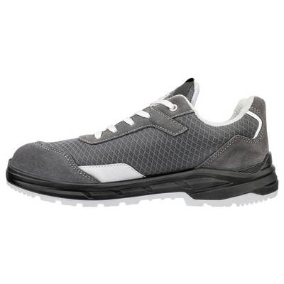 Chaussure de sécurité grise basse avec semelle noire, lacets blancs et bout renforcé, présentée en vue latérale sur fond blanc