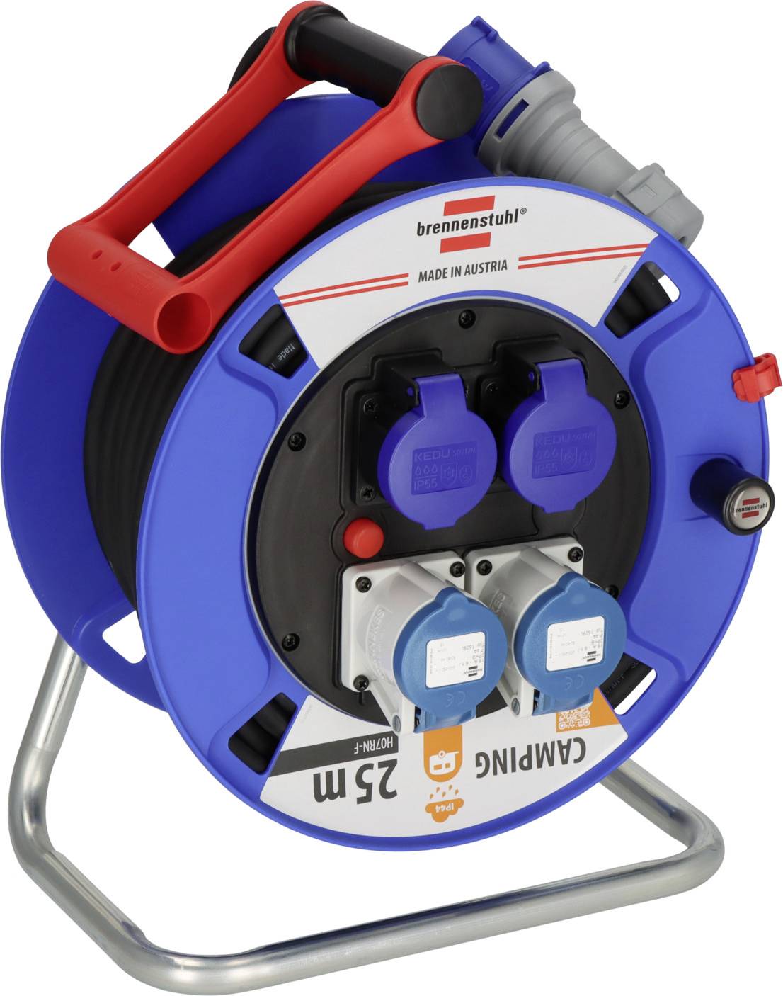 Bobine de câble bleu avec poignée rouge et plusieurs prises de courant protégées sur un support métallique, portant les inscriptions « brennenstuhl » et « FABRIQUÉ EN AUTRICHE ».