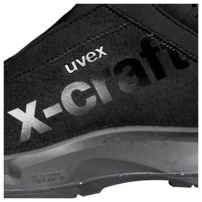 Gros plan d'une botte de chaussure de travail Uvex X-Craft noire avec logo de marque visible et semelle robuste.