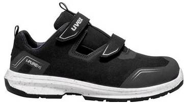 Chaussure de sport noire avec semelle blanche et fermetures à scratch, présentée en vue latérale sur fond blanc.