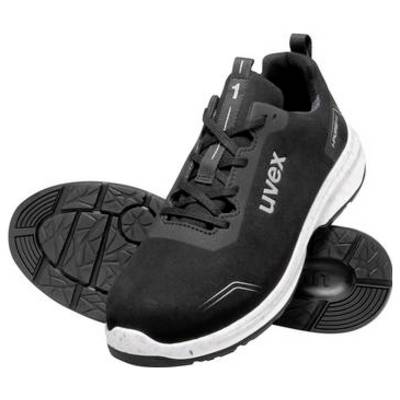Chaussure de sécurité athlétique Uvex noire avec semelle blanche, présentée de profil avec la semelle extérieure visible.