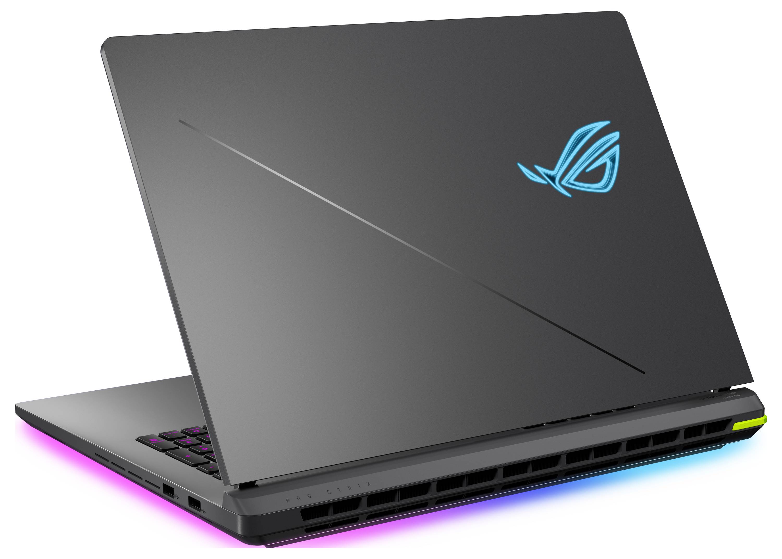 Ordinateur portable de jeu noir fermé avec un logo ROG bleu luminescent et des accents de lumière RGB le long de la base.