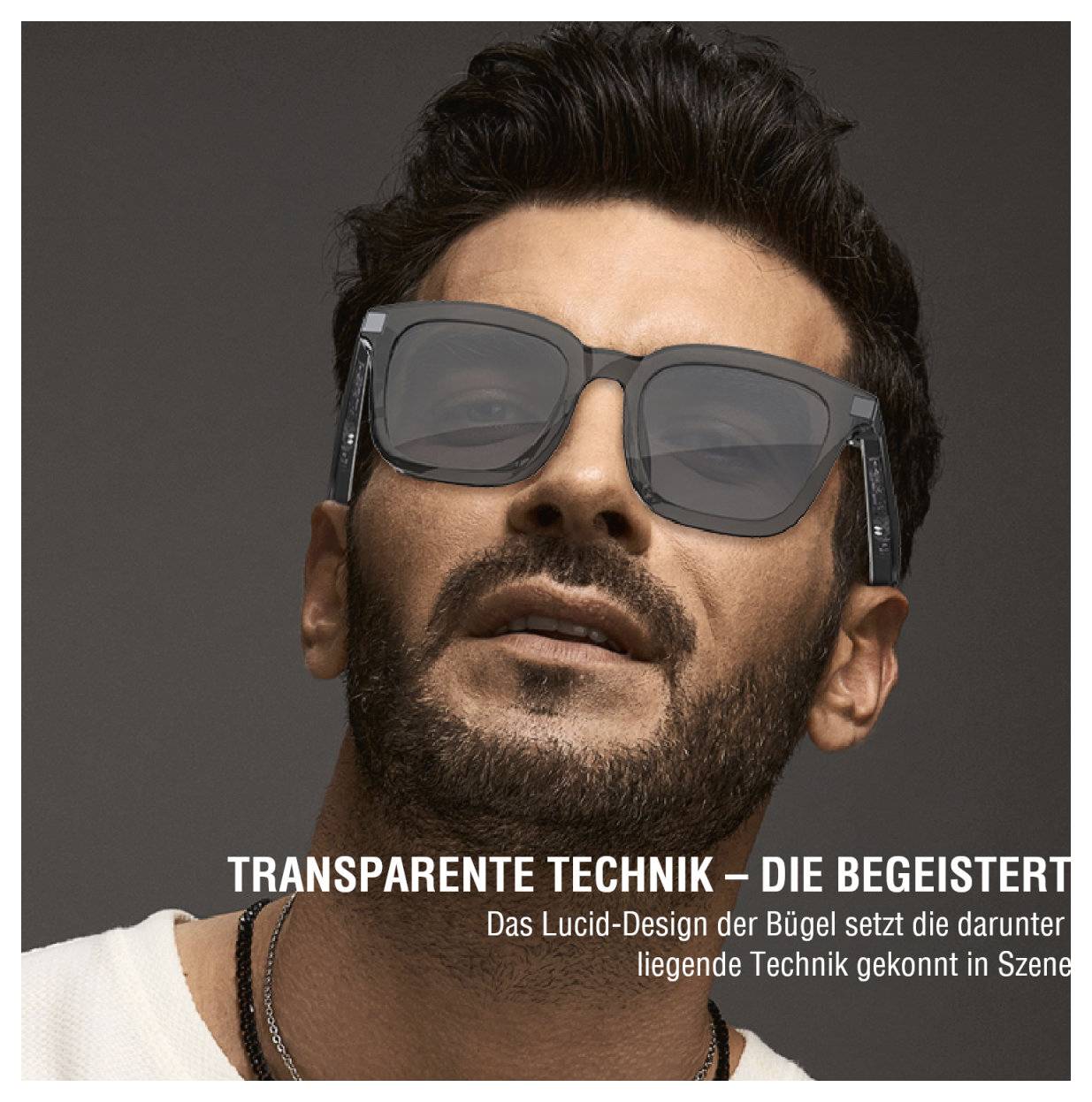 Gros plan d'un homme portant des lunettes de soleil avec des branches transparentes ; le texte allemand met en évidence le design de la « technologie transparente ».