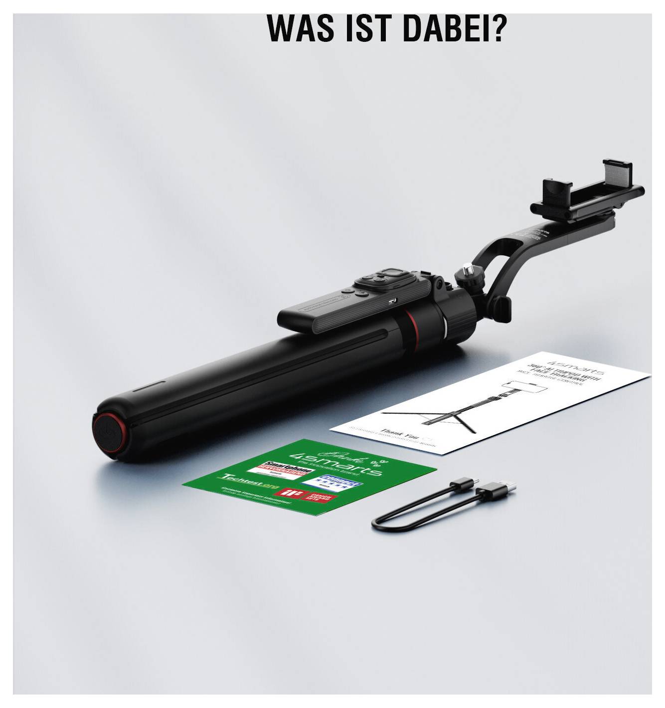 VOICI TOUT CE QUI EST INCLUS ?<br><br>[Product photo of a black selfie stick/pole with clamp, plus included manuals/cards and a cable on a white background]
