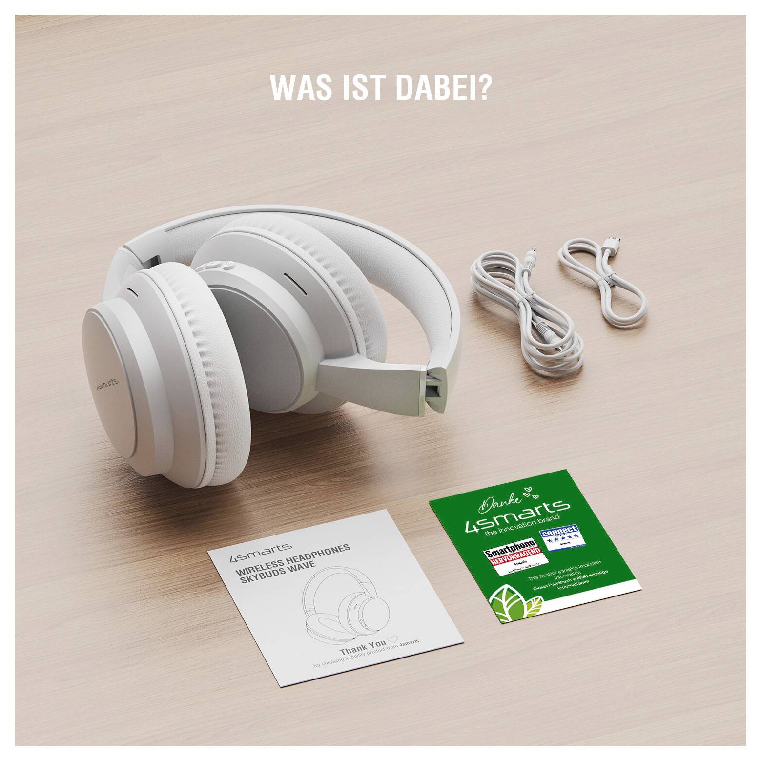 Casque audio sans fil blanc supra-auriculaire avec deux câbles de charge et cartes produit sur une table ; le texte indique « WHAT'S INCLUDED? » et « LSmart »