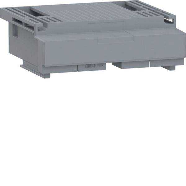 Boîtier de composant électronique en plastique gris avec dessus aéré et fentes latérales, présenté isolé sur fond blanc.