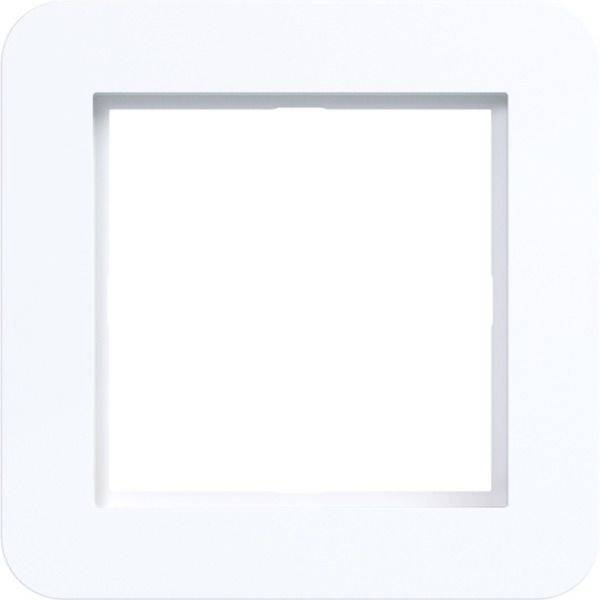 Bouton ou cadre carré blanc avec un centre vide en retrait sur un fond clair.