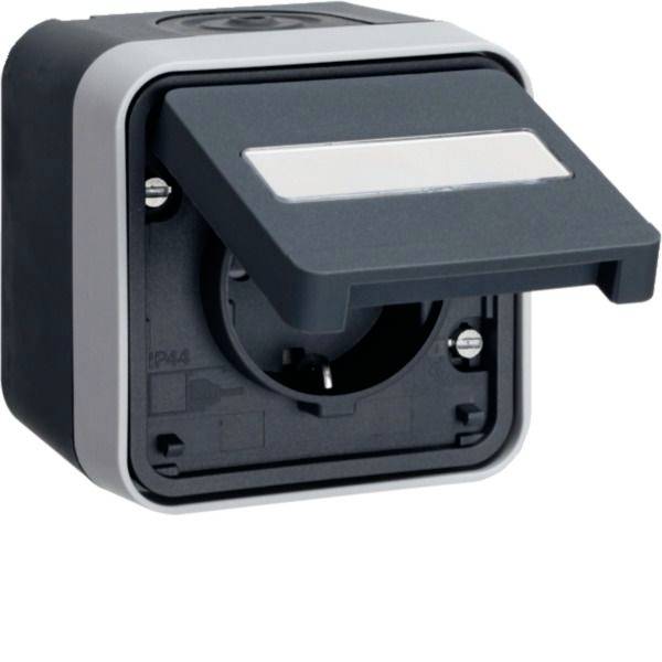 Prise électrique extérieure étanche avec couvercle de protection articulé et ouverture de prise centrale.