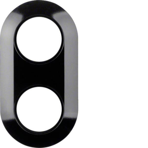 Couvercle de lentille de caméra double ovale noir et gris avec deux découpes circulaires sur fond blanc.