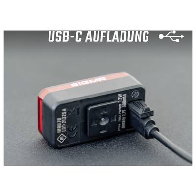 Illustration d'une batterie Sigma chargée via USB-C ; texte en haut : « CHARGEMENT USB-C ».