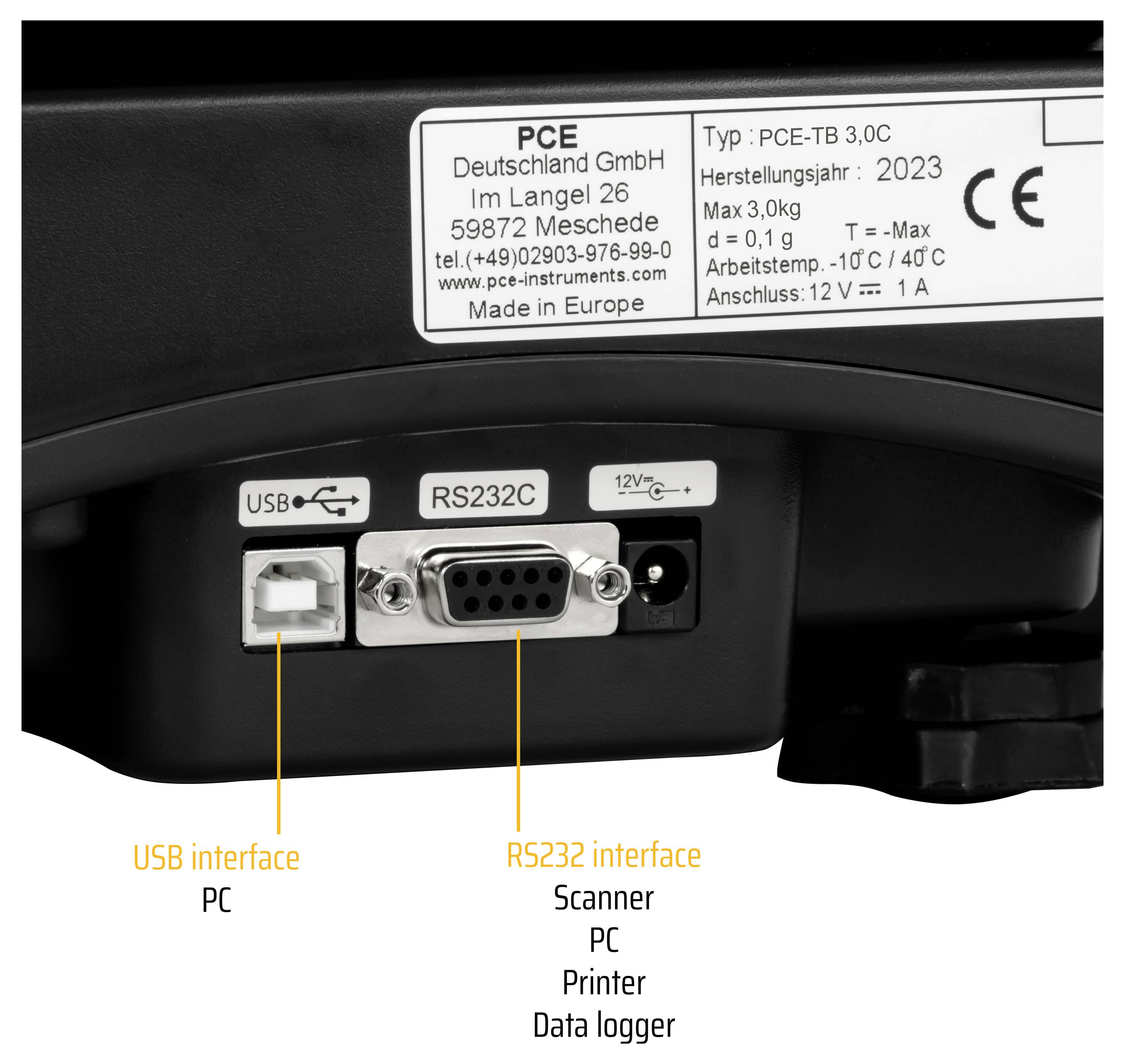 Gros plan du panneau arrière d'un appareil montrant les ports USB, RS232 et alimentation 12V, avec des étiquettes indiquant l'USB pour PC et RS232 pour scanner, imprimante ou enregistreur de données.