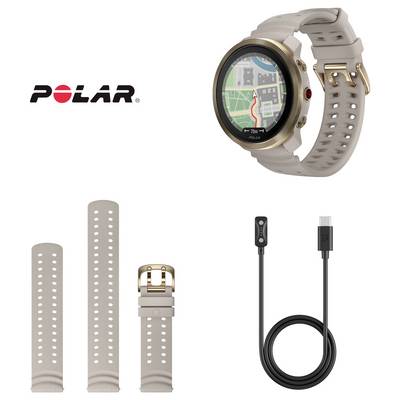 Montre intelligente Polar avec bracelet beige présentée avec des pièces de bracelet supplémentaires et un câble de charge USB sur un fond blanc.