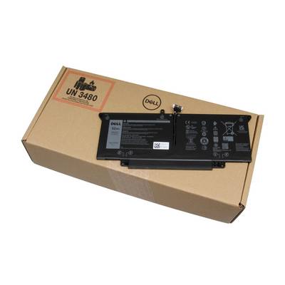 Un bloc batterie pour ordinateur portable Dell repose sur une boîte d'expédition en carton portant l'étiquette UN 3480, indiquant le transport de batteries au lithium.